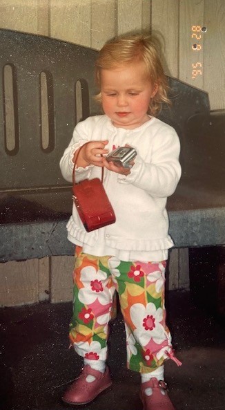 Pam's granddaughter wearing bright-colored pants with a flower pattern